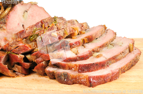 Image of Roast pork on a wooden board