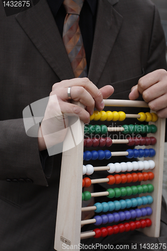 Image of Businessman with abacus