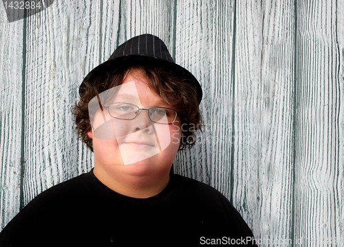 Image of Happy teenage boy wearing hat