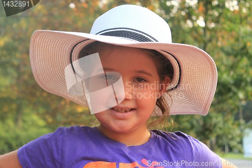 Image of Portrait of a pretty little girl in beige hat