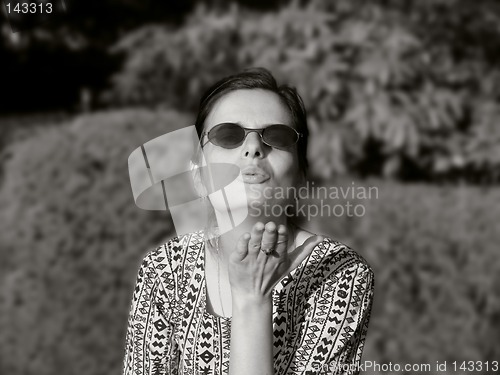 Image of Girl blowing a kiss