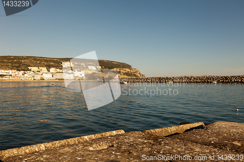 Image of Lighthouse in port.