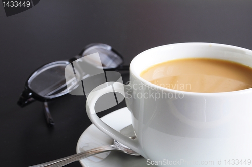 Image of cup of coffee in the office