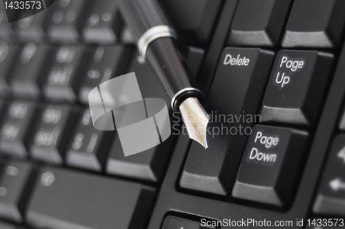 Image of pen and keyboard