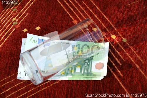 Image of Empty Glass on Euro Banknotes