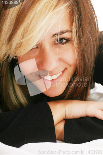 Image of happy beautiful woman lies on a pillow in the bedroom, beautiful