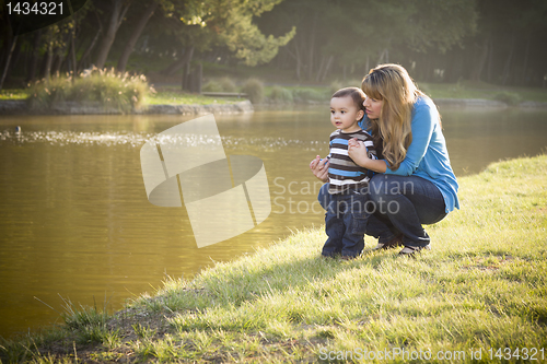 Image of Happy Mother and Baby Son Looking Out At Lake