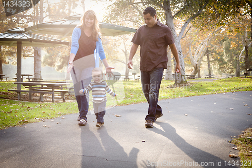Image of Happy Mixed Race Ethnic Family Walking In The Park