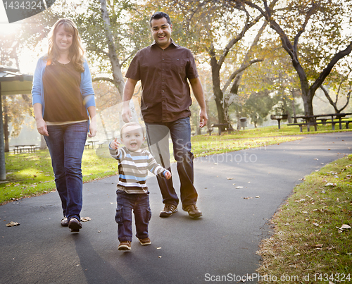 Image of Happy Mixed Race Ethnic Family Walking In The Park