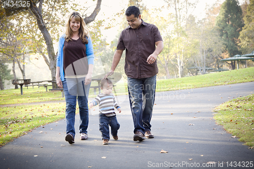 Image of Happy Mixed Race Ethnic Family Walking In The Park