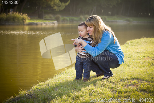 Image of Happy Mother and Baby Son Looking Out At Lake