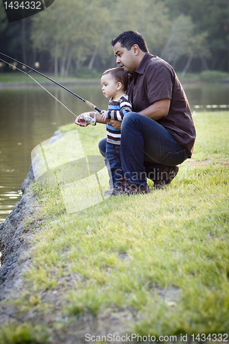 Image of Happy Young Ethnic Father and Son Fishing