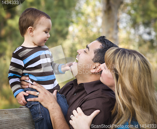 Image of Happy Mixed Race Ethnic Family Playing In The Park