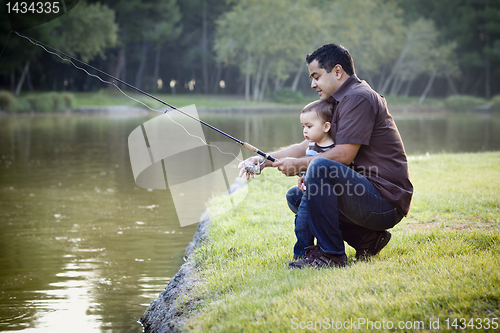 Image of Happy Young Ethnic Father and Son Fishing