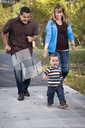 Image of Happy Mixed Race Ethnic Family Walking In The Park