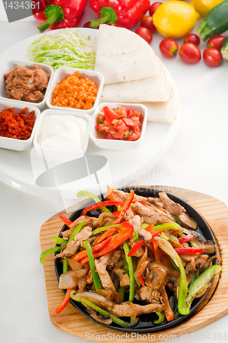 Image of original fajita sizzling hot  on iron plate