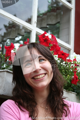 Image of Smiling girl among flowers