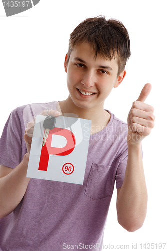 Image of Teen boy holding P plates and car key