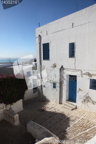 Image of Sidi Bou Said - typical building with white walls, blue doors and windows