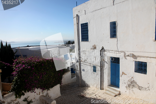 Image of Sidi Bou Said - typical building with white walls, blue doors and windows