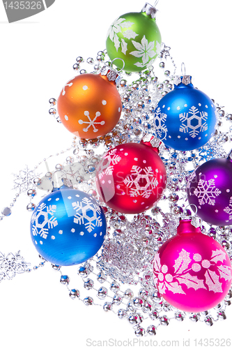 Image of christmas balls with snowflake symbols