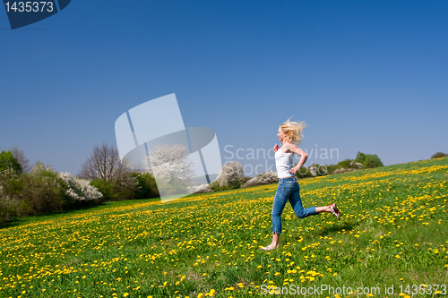 Image of happy young woman on meadow