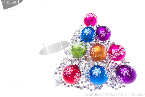 Image of christmas balls with snowflake symbols