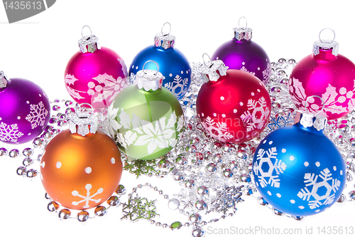 Image of christmas balls with snowflake symbols