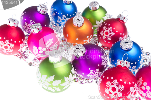 Image of christmas balls with snowflake symbols