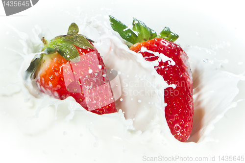 Image of strawberry splashing into milk