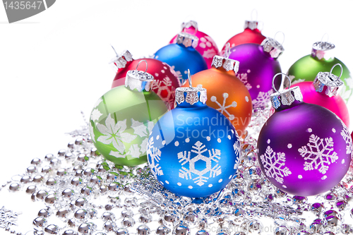Image of christmas balls with snowflake symbols