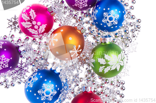 Image of christmas balls with snowflake symbols