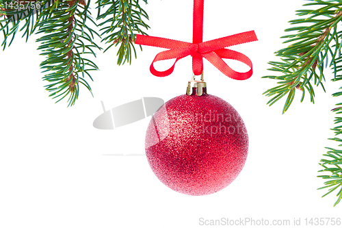 Image of red christmas ball hanging from tree