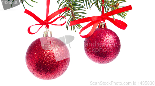 Image of red christmas ball hanging from tree