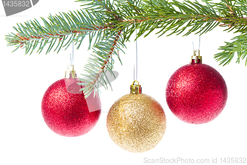 Image of red christmas ball hanging from tree