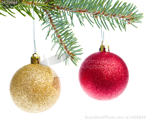 Image of red christmas ball hanging from tree