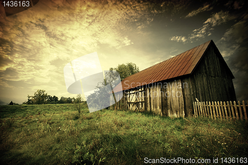 Image of sunset by an old barn