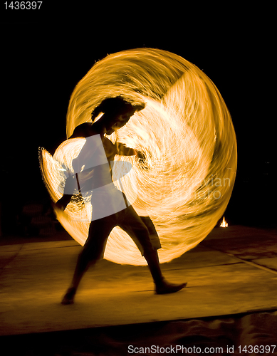 Image of Man dancing with fire