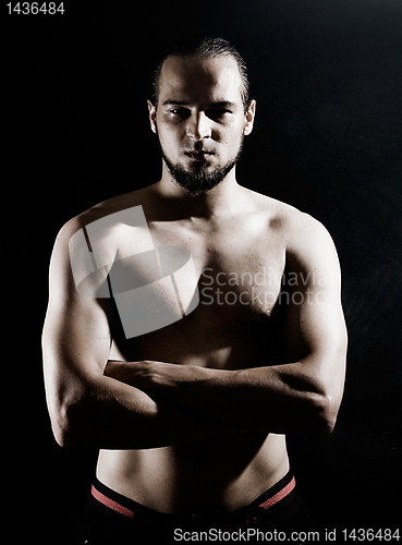 Image of Muscular man over black