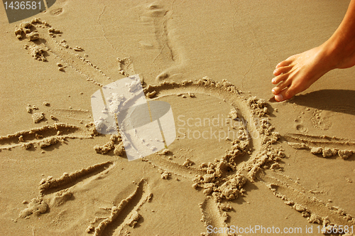 Image of Sun drawing on sand