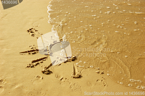 Image of Sun drawing on sand