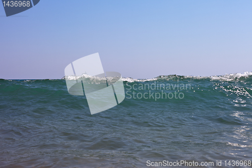 Image of silhouette of a sea wave in the sky