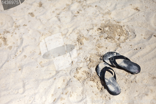 Image of Beach sandal on the sandy sea coast