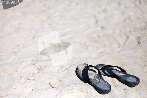 Image of Beach sandal on the sandy sea coast