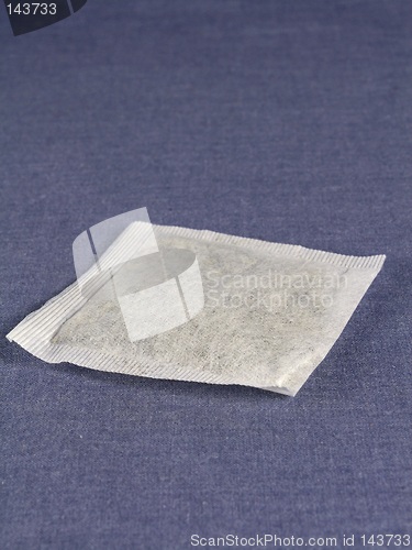 Image of tea bag on blue background