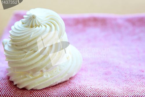 Image of Tasty white meringue on a napkin.