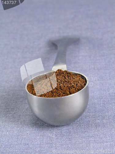 Image of spoon full of coffee