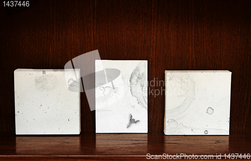 Image of canvases on a shelf