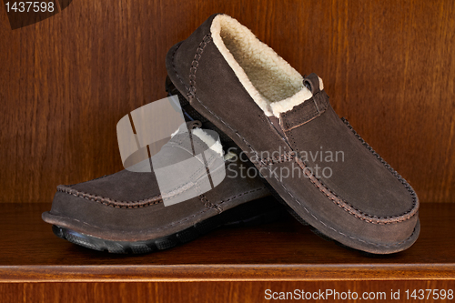 Image of brown shoes on shelf