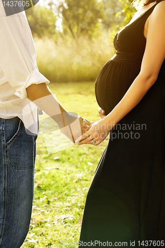 Image of man and pregnant wife